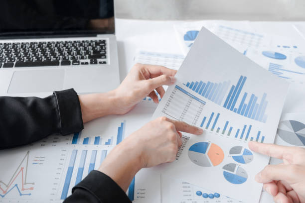 istock Business team hands at working with business plan and a tablet on office desk. 810031482
