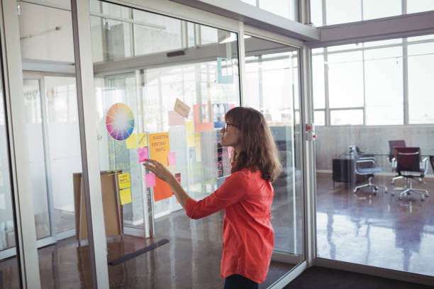istock Businesswoman analyzing strategies in creative office 810056848