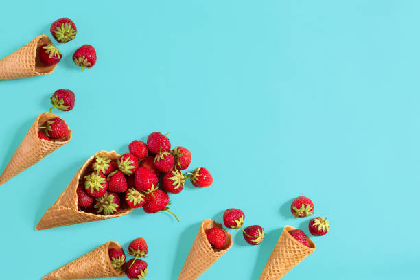 istock Fresh strawberry in waffle cones. Creative food concept. Flat la 810057502