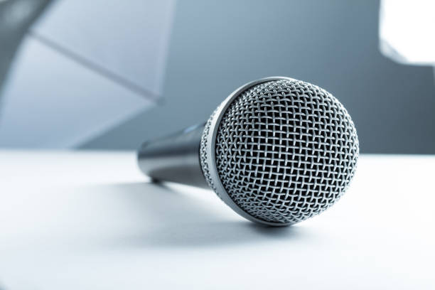 istock Concept of the interview, wireless microphone in the studio on the desk. 810067108