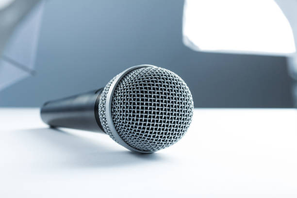istock Concept of the interview, wireless microphone in the studio on the desk. 810067114