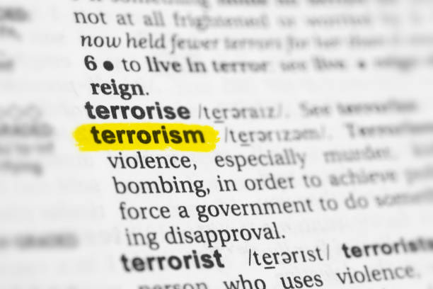 Highlighted English word "terrorism" and its definition Highlighted English word "terrorism" and its definition at the dictionary. terrorist stock pictures, royalty-free photos & images