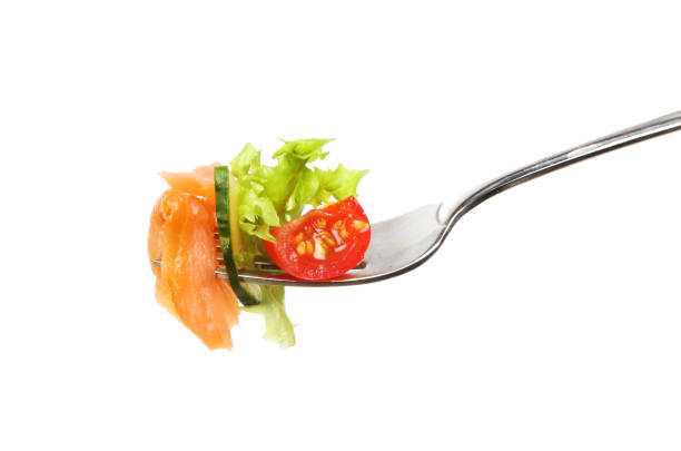 istock Smoked salmon and salad on a fork 810102452