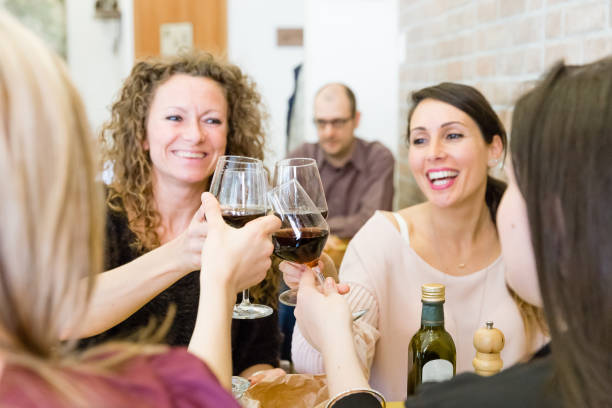 istock friends toasting with red wine 810107840