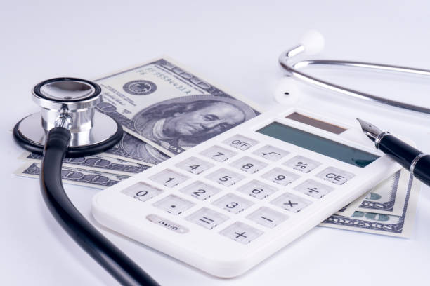 istock Economic Diagnosis Concept - Dollars, Calculator, Stethoscope 810110922