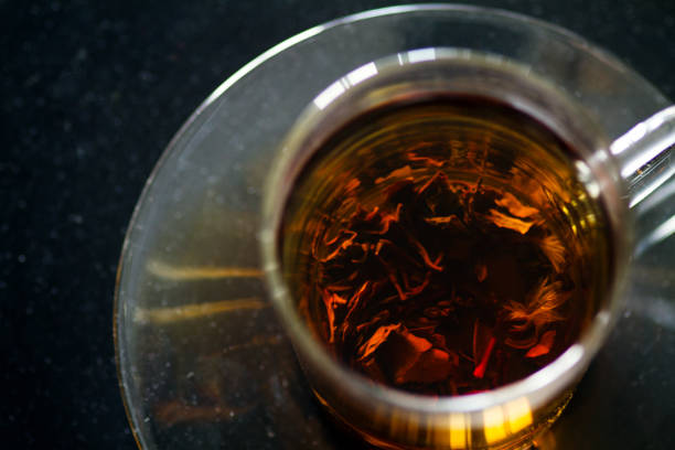 istock A cup of tea with marbles on a black table. 810111096