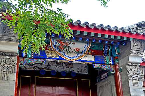 Beijing, China, August 17, 2014. Decoration of Beijing Hutong House Entrance with Colourful Traditional Chinese Painting. Hutong is the old Beijing residential area.