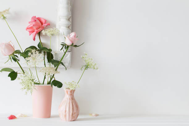 istock Roses in a vase on a white background 810117408