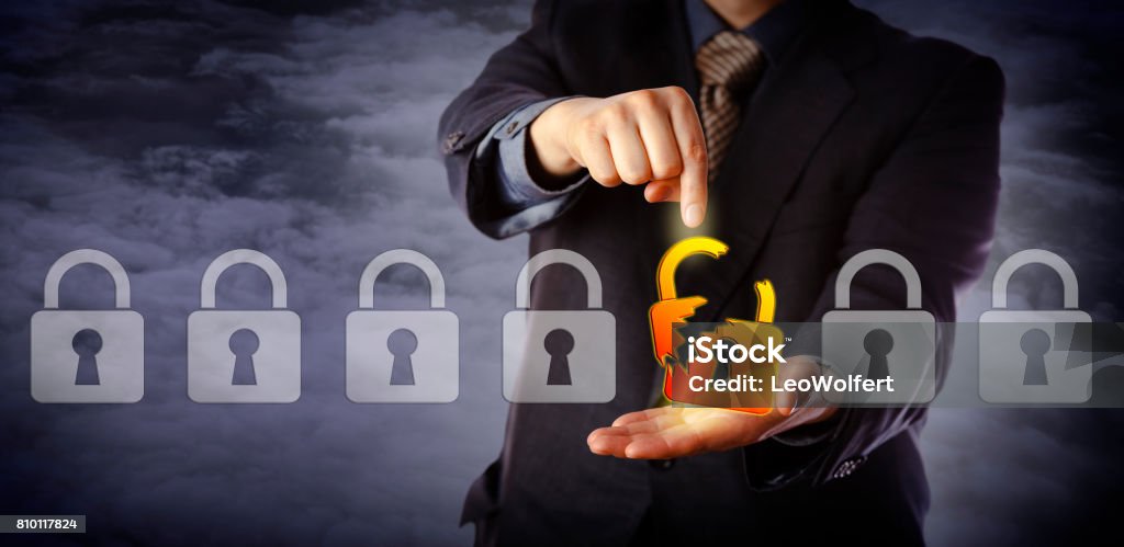 Security Manager Identifying Cyber Attack Blue chip cyber security manager is pointing out a broken virtual padlock in a lineup of otherwise intact locks. Information technology concept for data security breach, cyber risk and hacker attack. Breaking Stock Photo