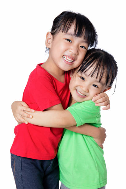 istock Asian Chinese little girls hugging each other 810117872