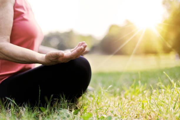 istock Senior woman doing yoga 810117952