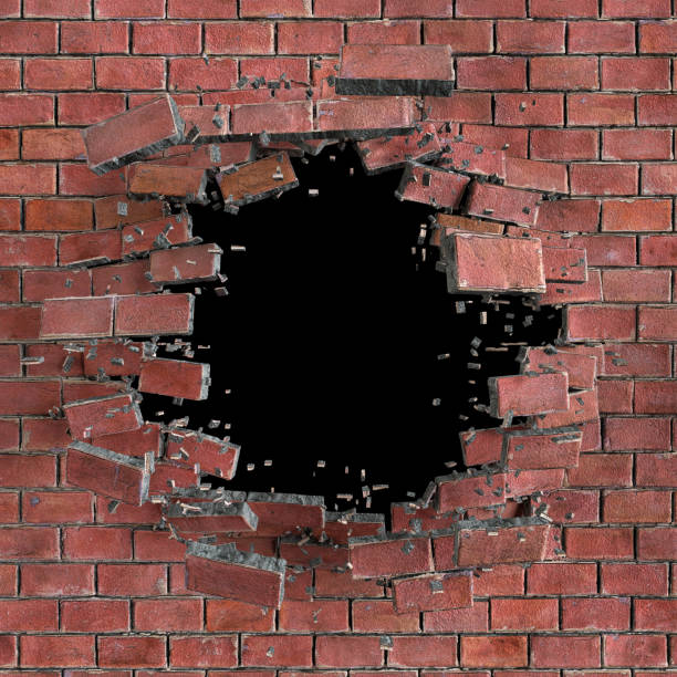 istock 3d render, 3d illustration, explosion, cracked red brick wall, bullet hole, destruction, abstract background 810117956