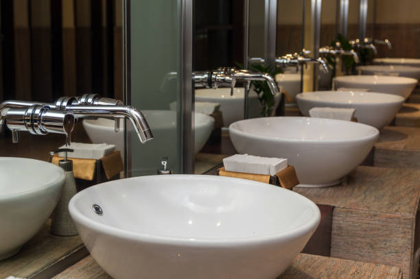 istock Chrome faucet with washbasin in modern bathroom 810125260