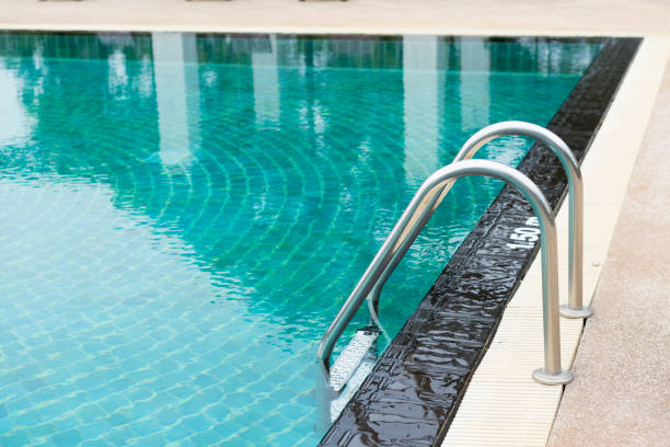 istock outdoor swimming pool with stair in a building 810130588
