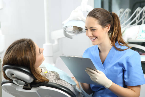 istock Dentist with medical history asking to a patient 810137450
