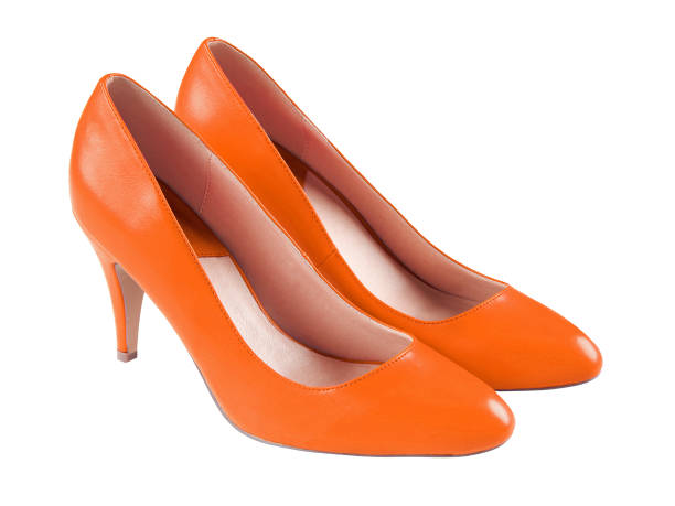 istock Spike orange leather high heels isolated on white 810137612