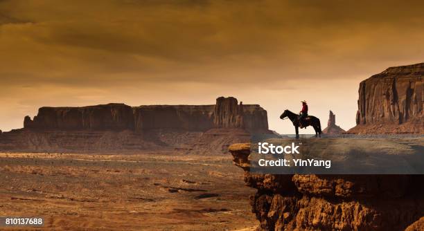 Western Cowboy Native American On Horseback At Monument Valley Tribal Park Stock Photo - Download Image Now