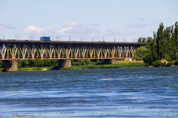 istock Bridge with traffic over the Dnieper river in Kremenchug, Ukraine 810140084