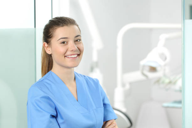 female doctor posing in a dentist office - medical assistant imagens e fotografias de stock