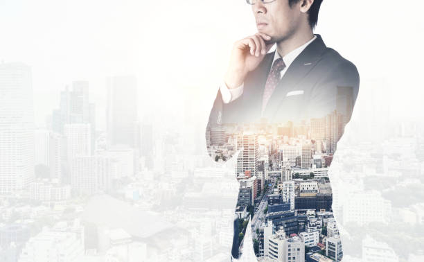 istock modern office man with dark suit, double exposure effect with Japan city skyline background 810150000