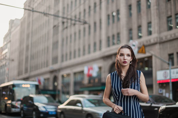 istock Beautiful woman holding suitcase 810158554