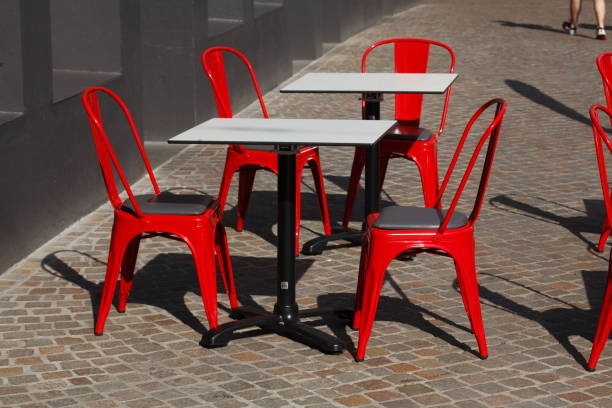 istock Red metal chairs and wiesse tables 810161722