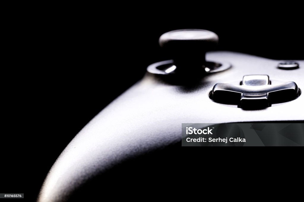 Close up studio shot of gamepad on black background Gamepad on black background - close up studio shot Competition Stock Photo