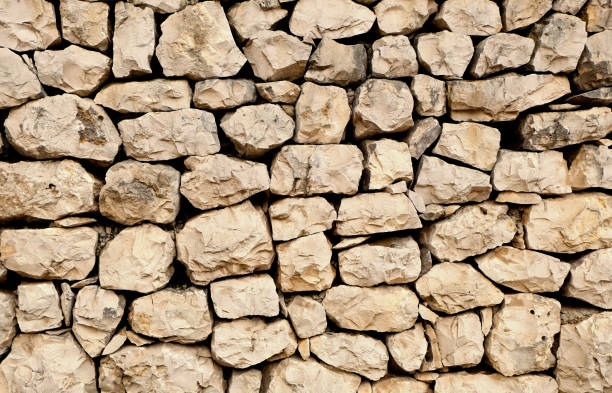 istock stacked rock wall with naturally shaped stones 810171976