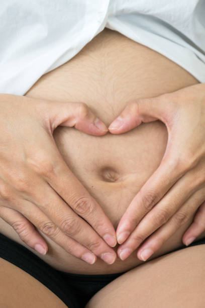 istock pregnant woman with hands 810184406
