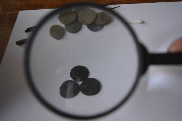 istock Roman coins, Cleaning 810219572