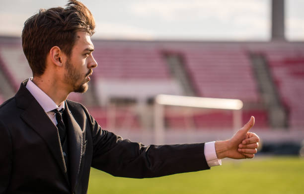 Football manager on the field Manager man standing on soccer field and showing thumbs up club soccer photos stock pictures, royalty-free photos & images