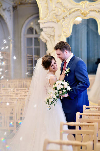 istock Wedding couple indoors is hugging each other 810238416