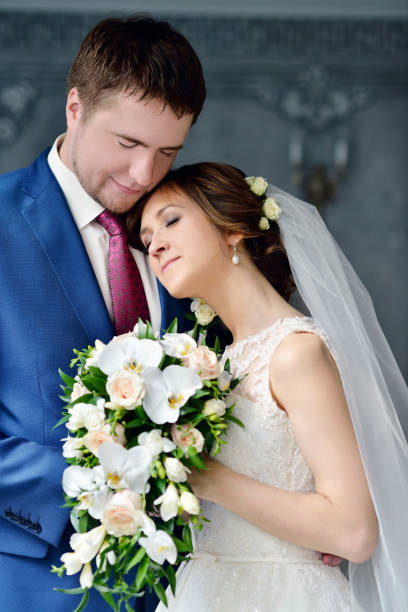 istock Wedding couple indoors is hugging each other 810256132