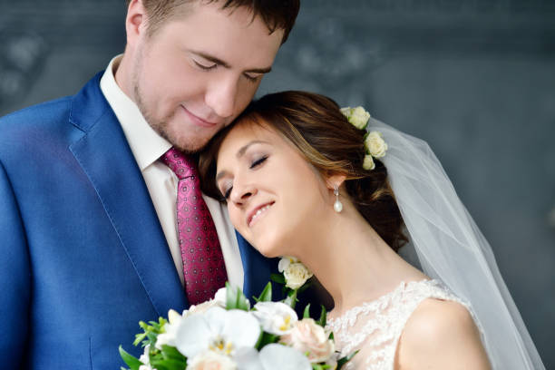 istock Wedding couple indoors is hugging each other 810256186