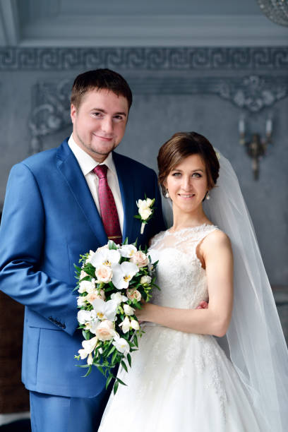 istock Wedding couple indoors is hugging each other 810256350