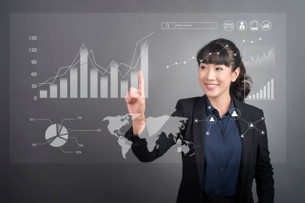 istock Beautiful Business Woman touching finance graph technology on virtual screen 810275238