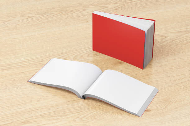 Blank soft cover books opened and standing