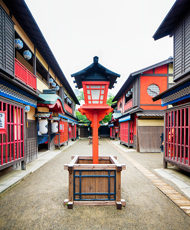 Japanese Edo village street movie set with lantern at Toei Studios Kyoto on an overcast day.