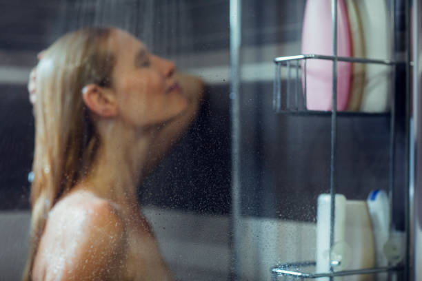 istock Woman taking a shower 810282392