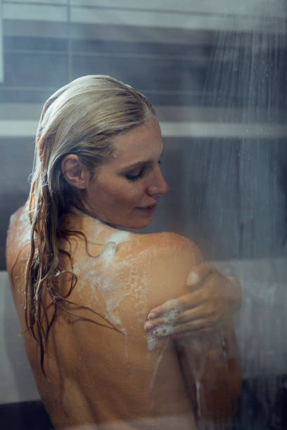 istock Woman taking a shower 810282614