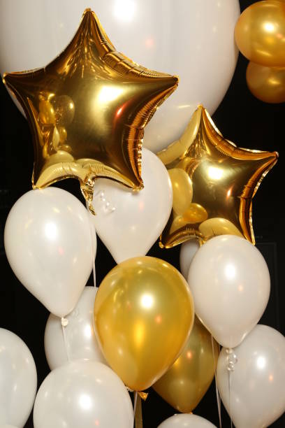 istock Helium balloons on black background. Close up 810285174