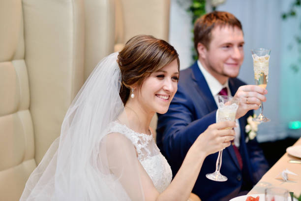 istock Beautiful wedding couple in restaurant 810288290