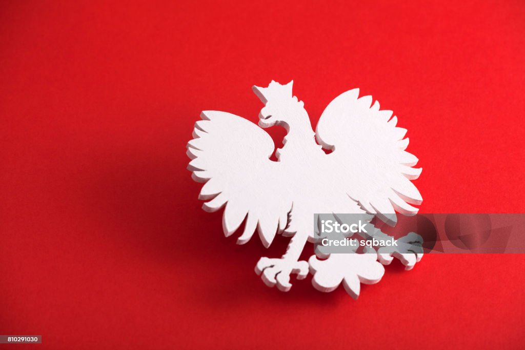 Polish coat of arms on red background Poland Stock Photo