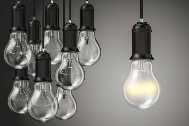istock Idea concept, group of lightbulbs in the dark. 3D rendering 810297496