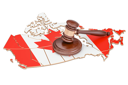 Wooden Gavel on map of Canada, 3D rendering isolated on white background
