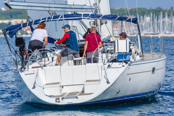istock Sailing crew on sailboat 810300722