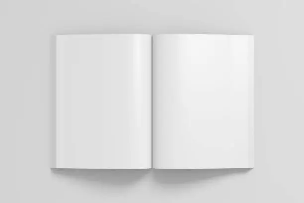 Blank pages of open portrait soft cover book with glossy paper. Isolated  on white background with clipping path around book. 3d illustration.