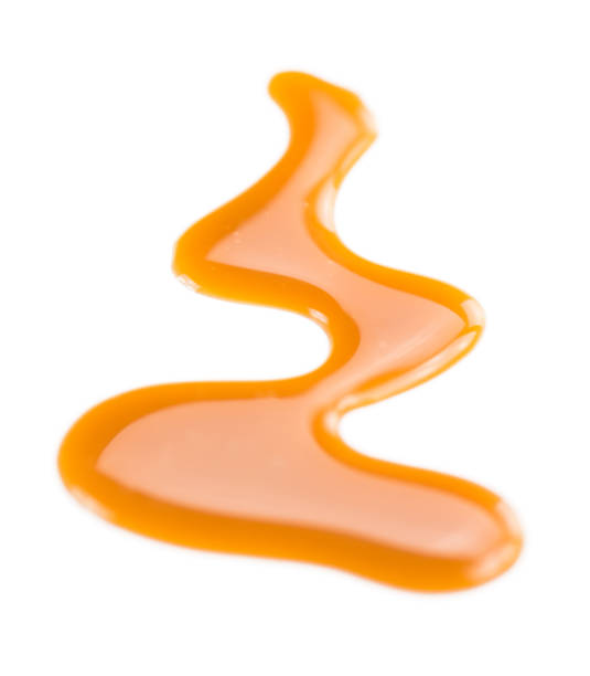 istock Portion of Caramel Sauce on a slate slab 810306714