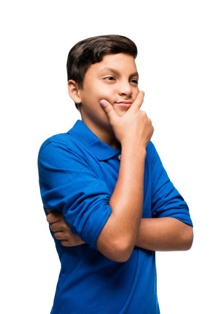 istock Latin boy with han on chin making a face 810312900