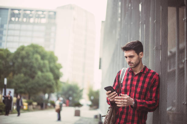 istock Young hipster man texting on the phone 810341090